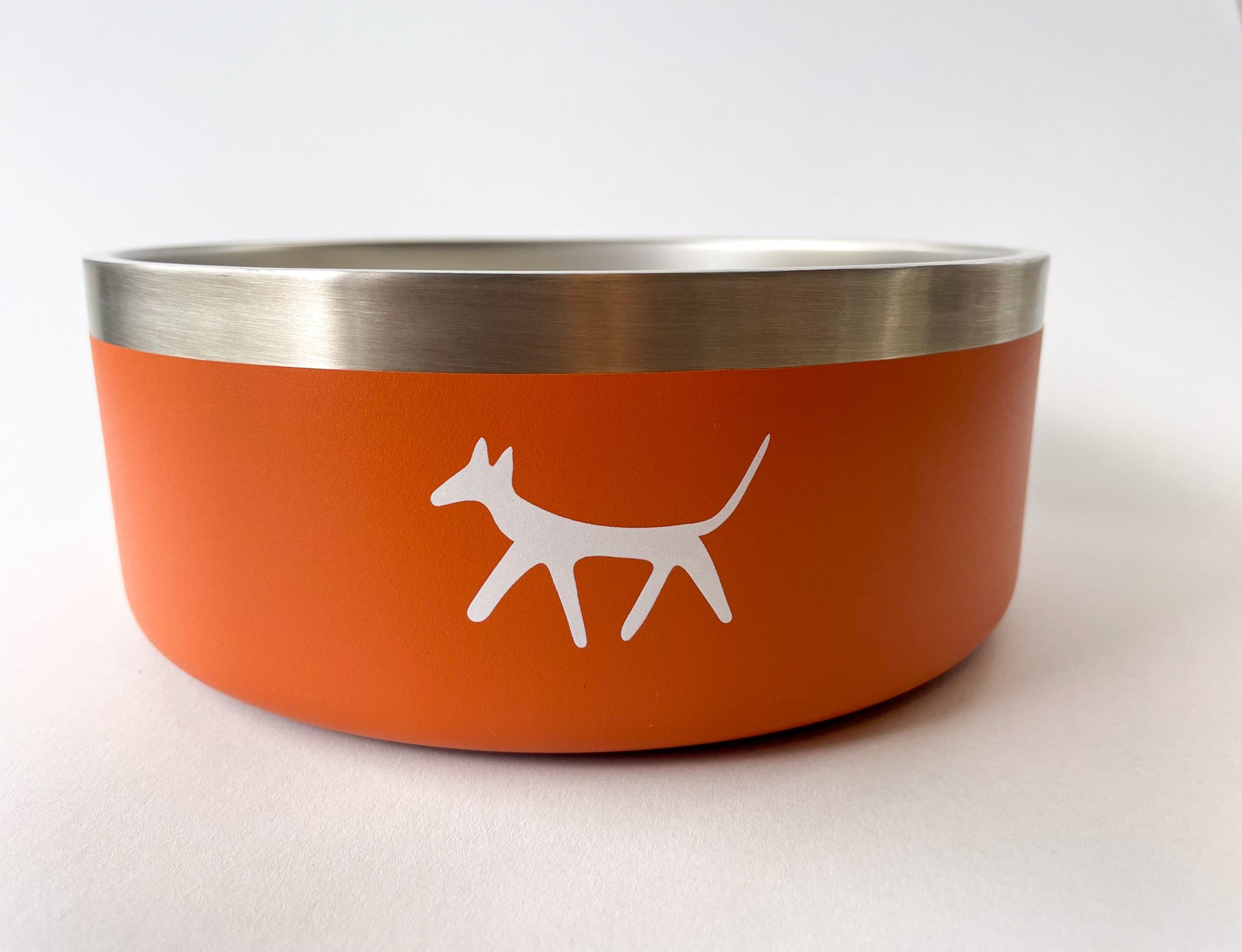 Stainless steel dog water bowl in rust colour with cream Droggo logo on the front. White background.