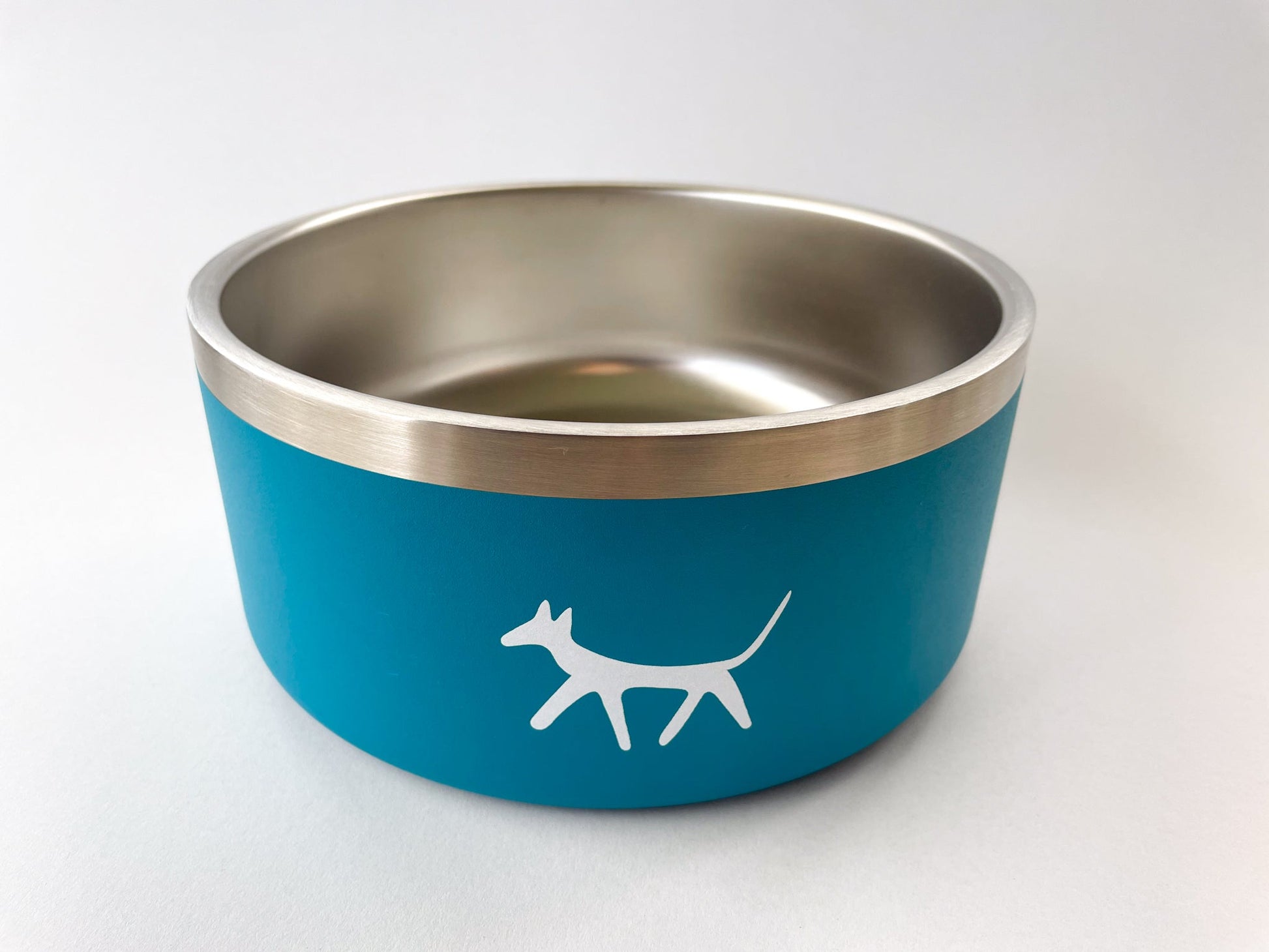 Birds eye view of stainless steel dog bowl in lake colour with cream Droggo logo on the front. White background.